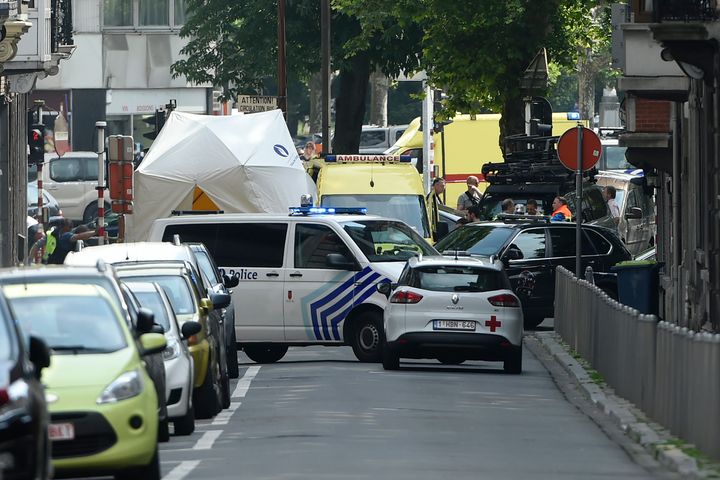 Police and ambulance are seen at the site where a gunman shot dead three people, two of them policemen, before being killed by elite officers, in the eastern Belgian city of Liege.