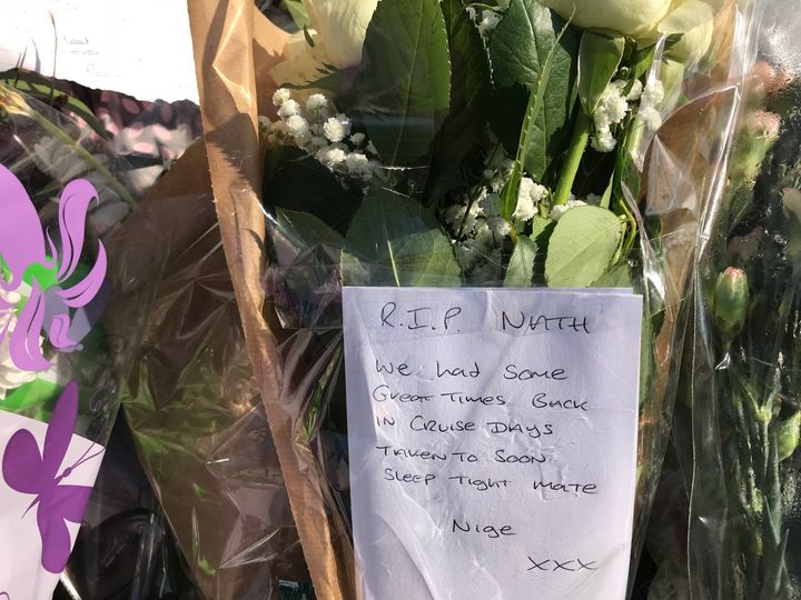 Floral tributes left at the scene where a 30-year-old man died after a car was driven into a group of people.