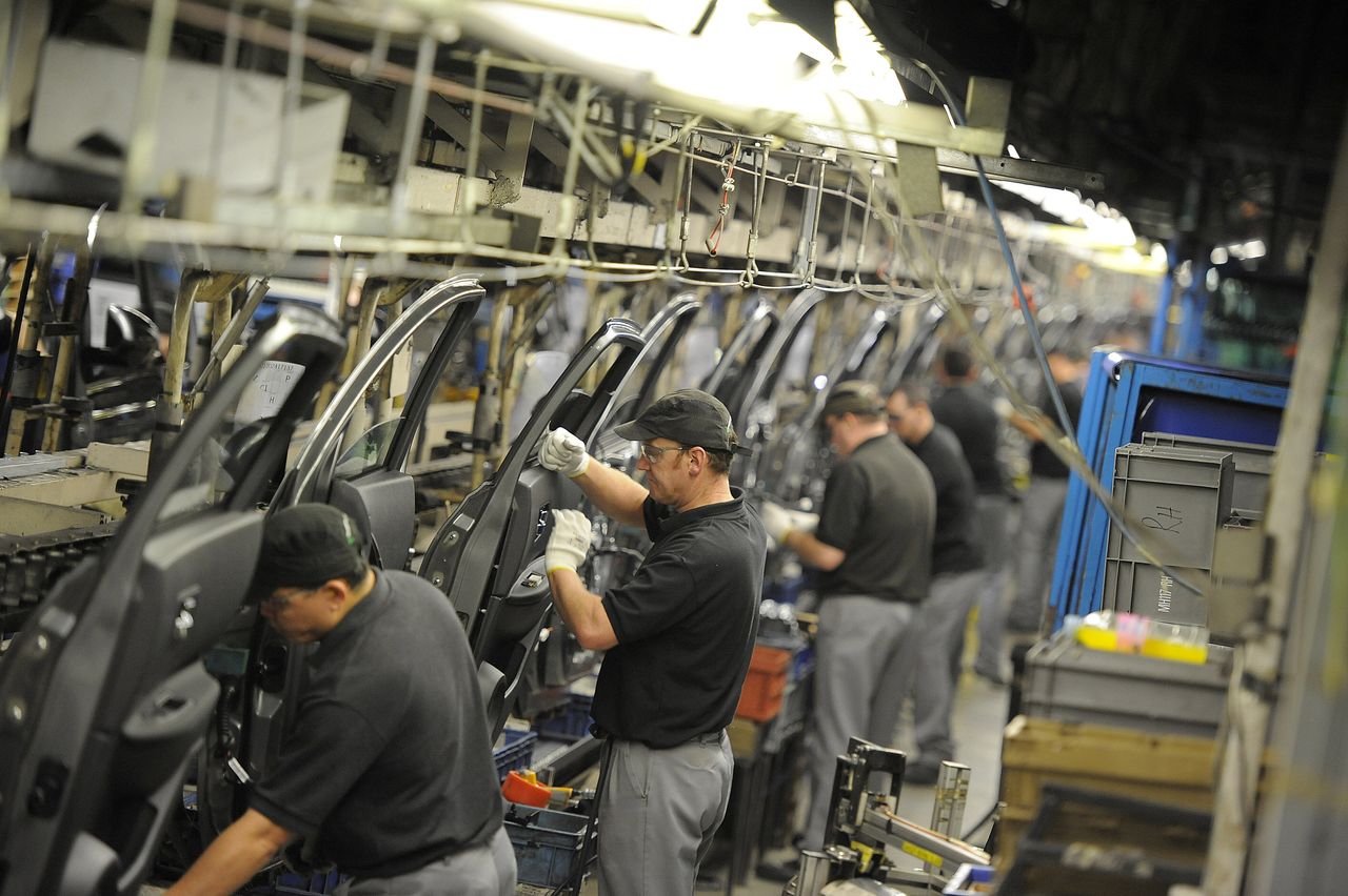 Workers preparing doors for the Qashqai car at the Nissan car plant in Sunderland.