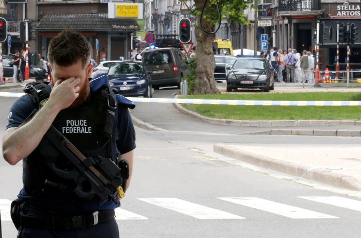 A police officer is seen on the scene of a shooting in Liege, Belgium.