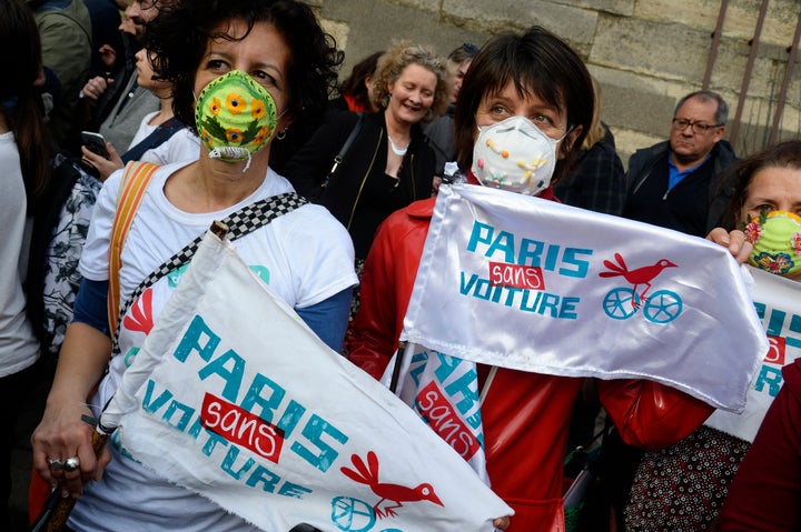 Supporters of the Paris Without Cars campaign hold banners at a rally in March.