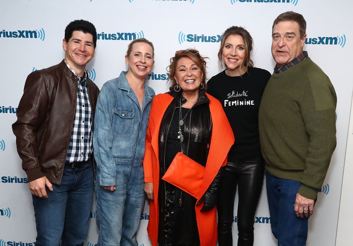 "Roseanne" actors Michael Fishman, Lecy Goranson, Roseanne Barr, Sarah Chalke and John Goodman pose for photos during SiriusXM's Town Hall event in New York on March 27.