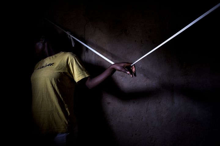 Yvette, a former Child Soldier is seen in her house in the Kasai Province, Democratic Republic of Congo.