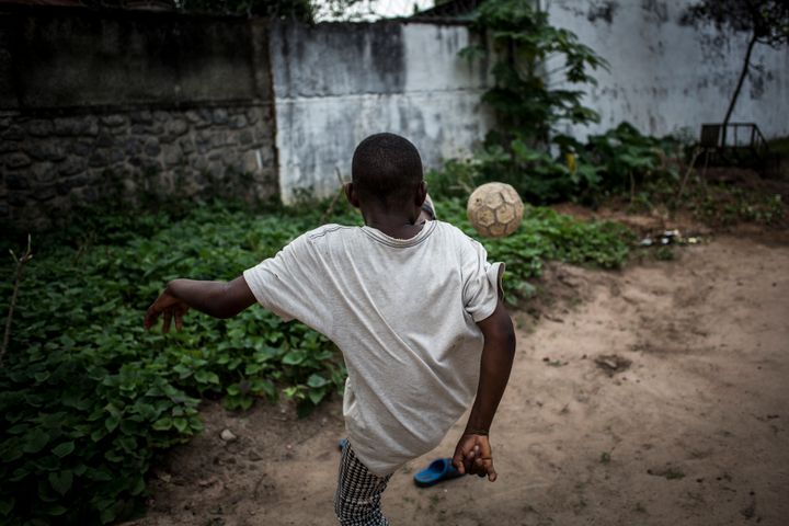 A former child soldier plays football at a rehabilitation centre in Kasai Province, Democratic Republic of Congo.