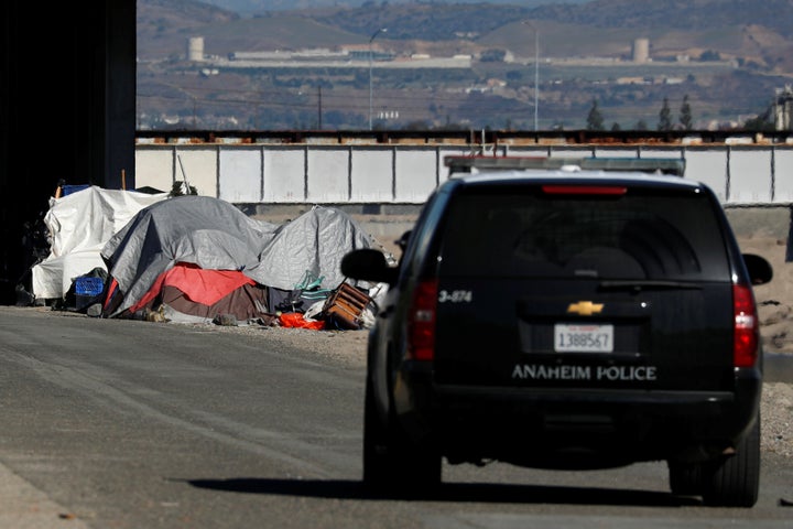 Police conduct a patrol as part of a campaign to clear a large homeless encampment in Anaheim, California on Jan. 22, 2018.