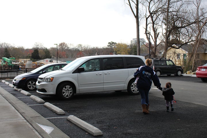A white van drives mothers and their children to the treatment center each day from the residential apartments, where staff