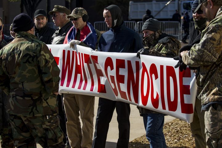 A group of neo-Nazis holds up a banner on Jan. 6 to protest the removal of two Confederate monuments in Memphis.