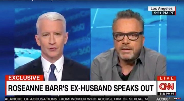 Tom Arnold, right, told Anderson Cooper on Wednesday that he was not surprised by the abrupt end to the reboot of "Roseanne."