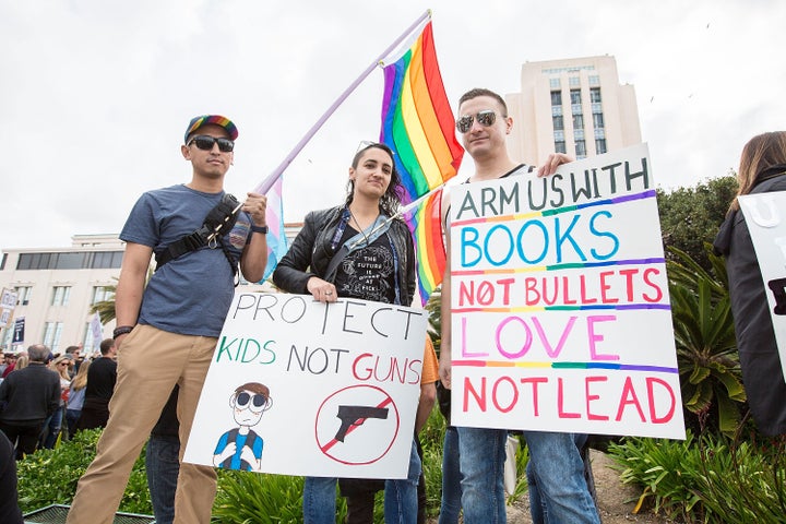 Alex Villafuerte, Jen LaBarbera and Fernando Lopez of San Diego Pride attend the March for Our Lives on March 24 in San Diego