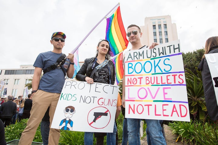 Alex Villafuerte, Jen LaBarbera and Fernando Lopez of San Diego Pride attend the March for Our Lives on March 24 in San Diego.