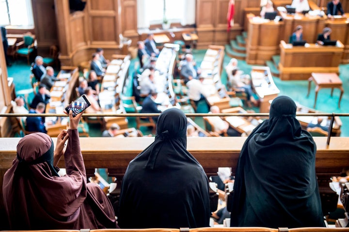 Women wearing niqabs sit in the gallery at the Danish Parliament in Copenhagen on Thursday.