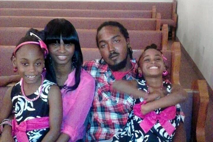 Gregory Hill Jr. with fiancée Monique Davis and two of his daughters. A sheriff’s deputy killed him in his garage in 2014, and his family has been awarded 1 percent of $4 in damages.