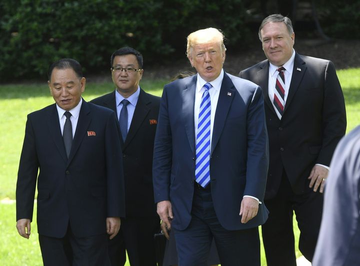 Trump flanked by US Secretary of State Mike Pompeo (R), walks with North Korean Kim Yong Chol (L) at the White House earlier today.