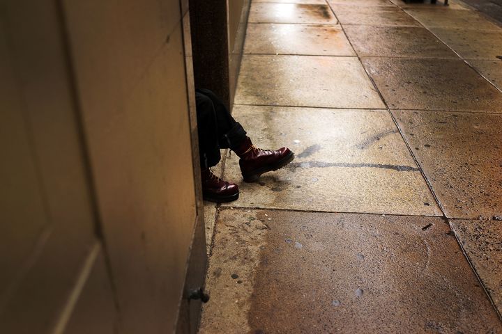 A man sitting in a doorway in downtown Philadelphia, one of the first HUD grant recipients to submit an assessment under the AFFH rule. “It was a lift, but it proved to be a worthwhile lift,” Anne Fadullon, the city’s director of planning and development, said of the process.