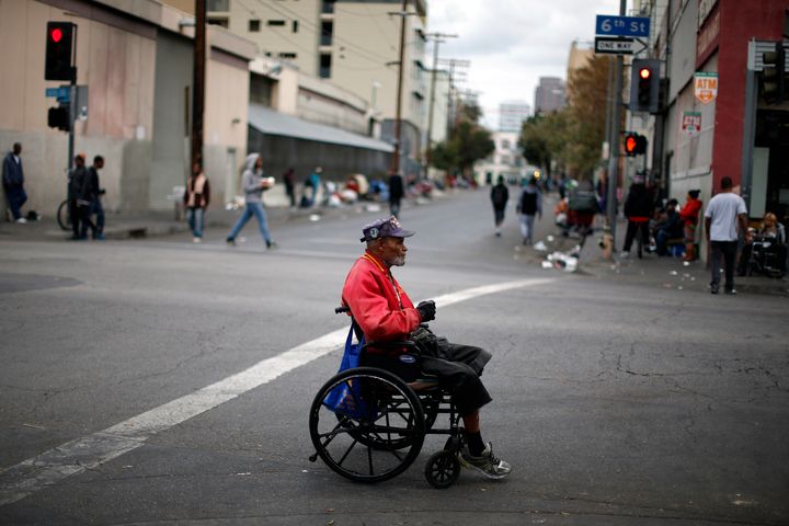 Arthur Turner, a homeless Korean War vet, crosses the road in Skid Row in Los Angeles. The U.N. Human Rights Council’s special rapporteur on extreme poverty and human rights went to the area as part of his visit to examine extreme poverty in America.