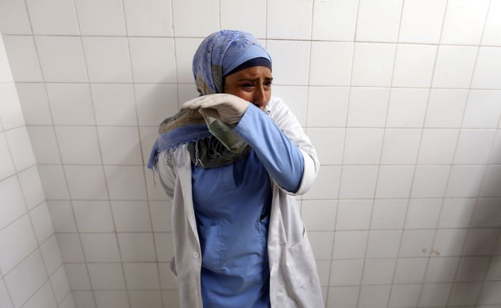 A colleague of Palestinian nurse Razan Al-Najar, who was killed during a protest at the Israel-Gaza border, reacts at a hospital in the southern Gaza Strip June 1, 2018. 