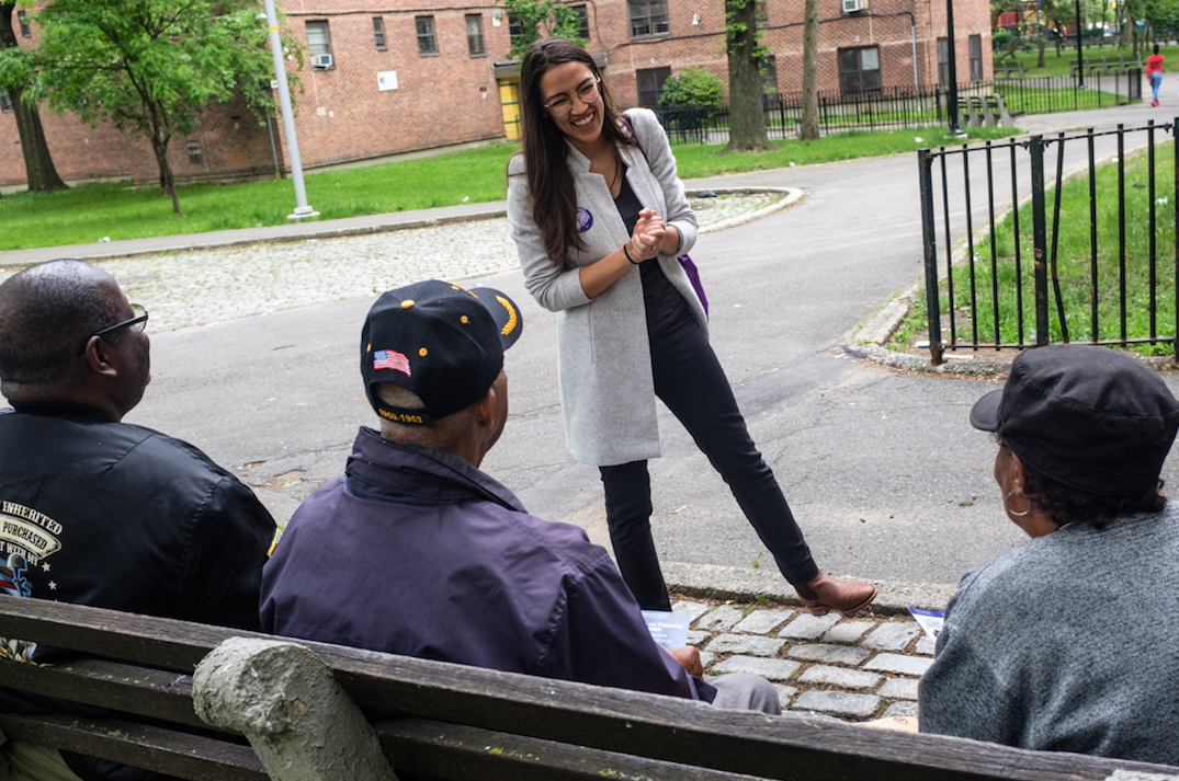 Alexandria Ocasio-Cortez canvasses in a Bronx, New York, neighborhood.