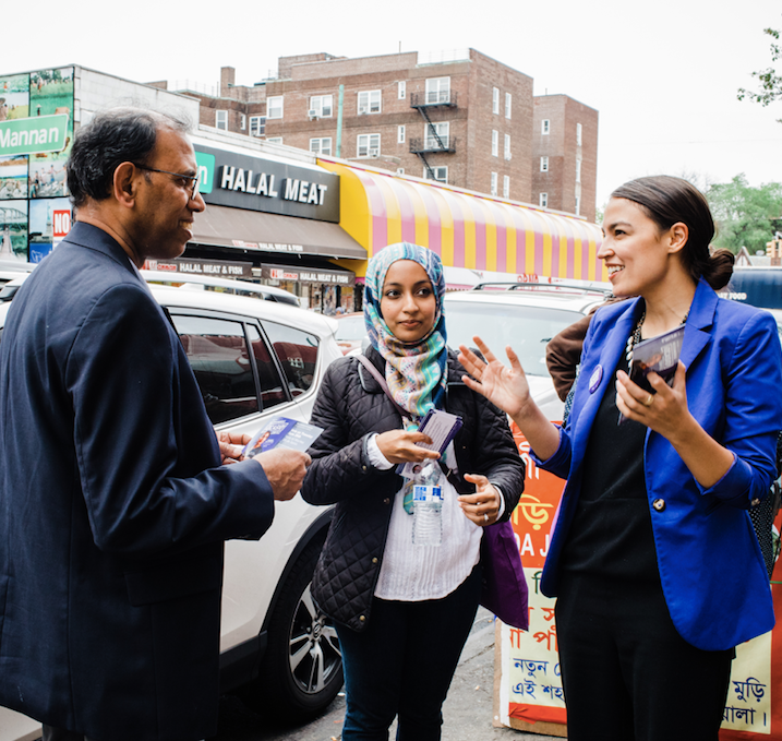 Alexandria Ocasio-Cortez talks with potential voters in the Queens borough of New York City.