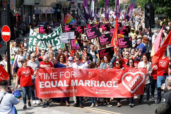Activists campaigning for an end to Northern Ireland's ban on same-sex marriage take part in a parade through Belfast city centre.