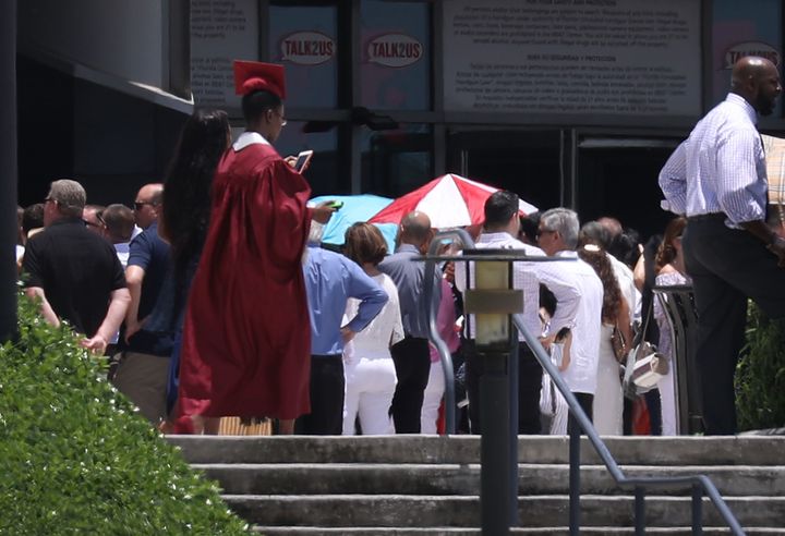A graduate walks as seniors from Marjory Stoneman Douglas High school attend their graduation ceremony on Sunday.