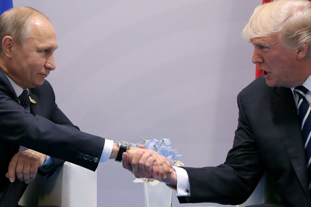Trump shakes hands with&nbsp;Russian President Vladimir Putin during the their bilateral meeting at the...