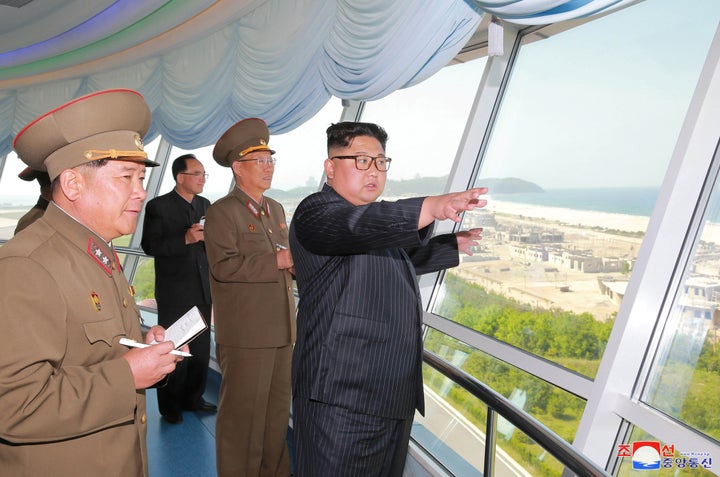 North Korean leader Kim Jong Un inspects the construction site of the Wonsan-Kalma coastal tourist area as Kim Su-gil (3rd L)