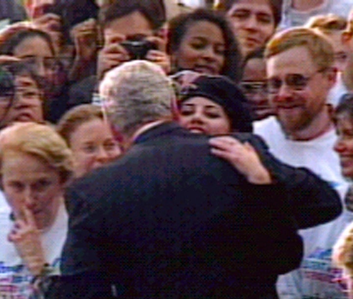 Former White House intern Monica Lewinsky hugs President Clinton at the White House, November 6 1996 during a ceremony gathering the White House interns.