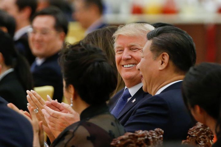President Donald Trump and China's President Xi Jinping attend a state dinner in Beijing in November 2017. Trump is now trading away national security goals with China for personal profit.