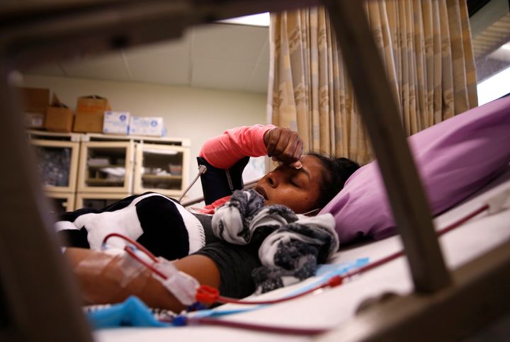 Dorca Carrillo receives her dialysis treatment at HIMA San Pablo Hospital in Caguas, Puerto Rico, on Sept. 29, 2017. With her usual treatment center down and little gas in her car after the storm hit, Carrillo was unable to get dialysis for a week. She feared she would die. Photo by Jessica Rinaldi via Getty Images.