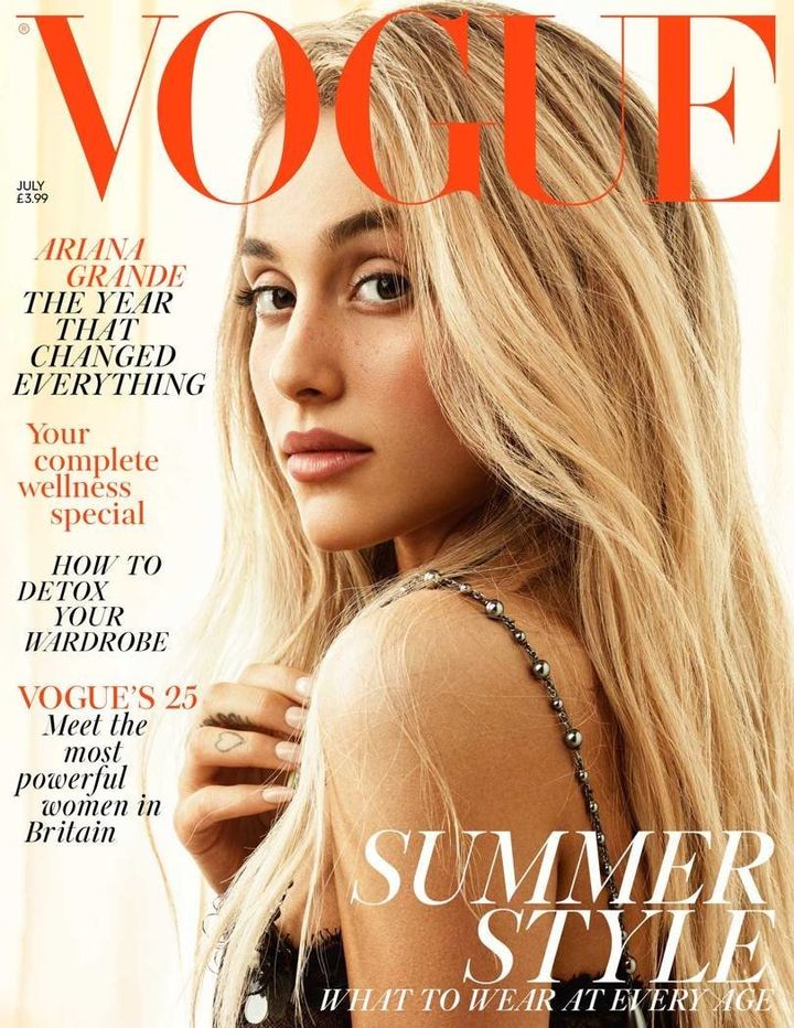 Grande wears a black lace dress on the cover, complete with metallic-like straps.