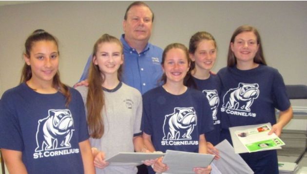 Students at  St. Cornelius School pose with the ballistic shields they were gifted by their school