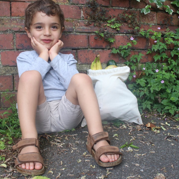 Four-year-old Jack takes his own canvas bag to the supermarket.