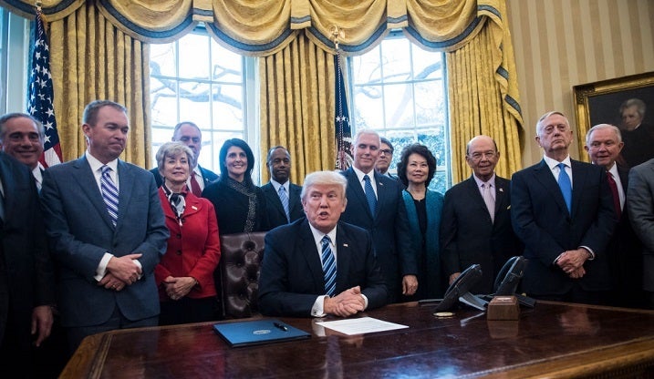 <p>President Trump, surrounded by members of his Cabinet, speaks before signing an Executive Order on White House organization in March, 2017. </p>