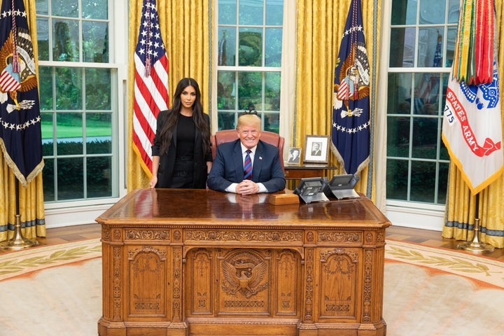 Kim Kardashian West appears in a photo with Donald Trump at the White House during a trip to discuss prison reform.