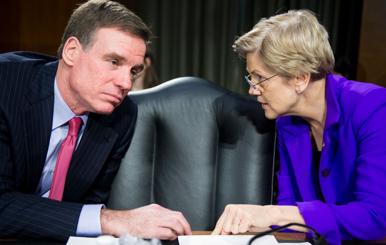 Sens. Mark Warner and Elizabeth Warren are both Democrats on the Senate banking committee but were on opposite sides of a bill to roll back banking regulations.