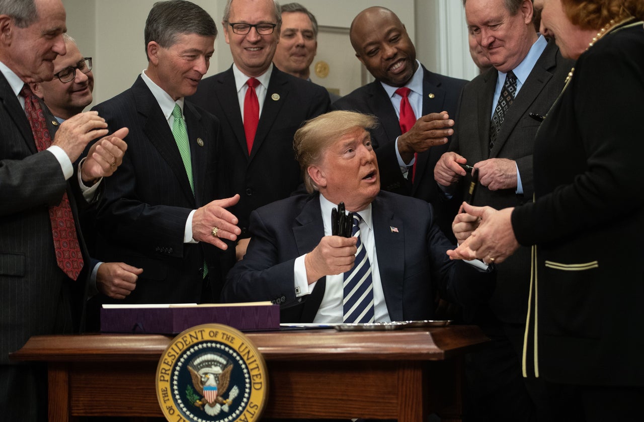 Sen. Heidi Heitkamp of North Dakota, far right, was the only Democrat at the bill’s signing.