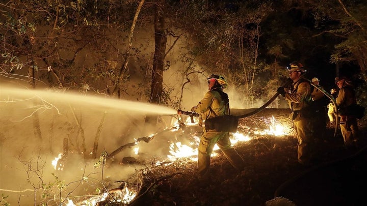 Fire crews battle an October wildfire in Santa Rosa, California. Pacific Gas & Electric has been sued some hundred times by victims of the wildfires that coursed through wine country last fall.