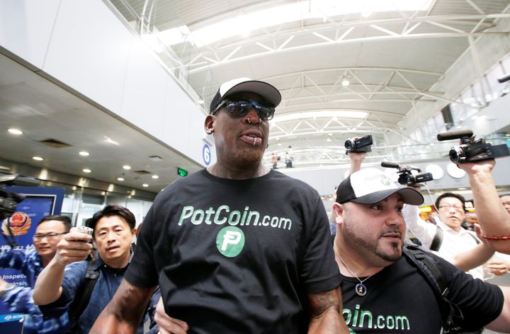 Former NBA basketball player Dennis Rodman arrives at Beijing Capital International Airport in PotCoin merchandise on his way to North Korea, June 13, 2017.