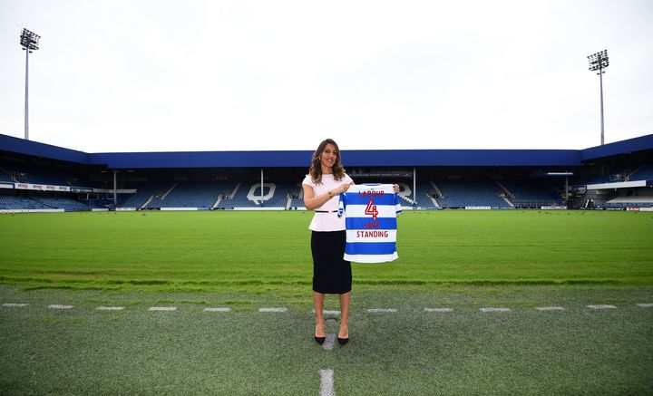 Shadow sports minister Rosena Allin-Kha holds a Labour 4 Safe Standing t-shirt, at Loftus Road, Queens Park Rangers ground, in West London as Labour has come out in favour of safe-standing in the Premier League and Championship, increasing the pressure on the government to follow suit.