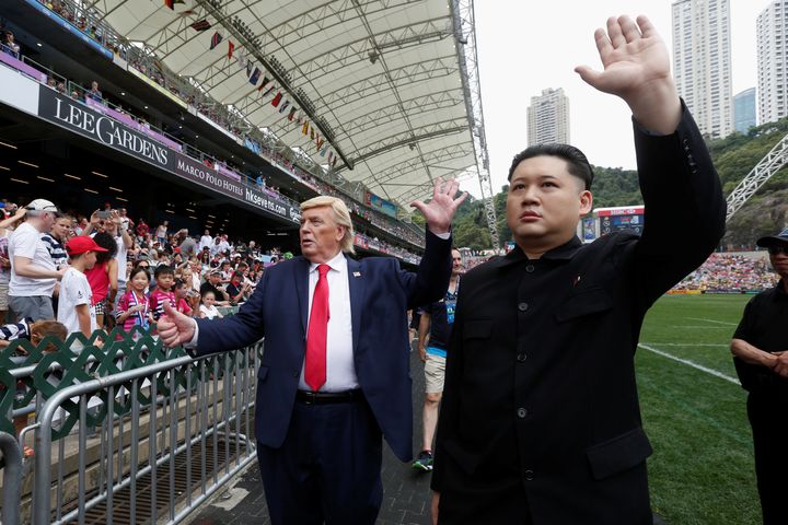 Trump impersonator Denis Alan pictured with the Kim Jong Un impersonator at Hong Kong Stadium in April