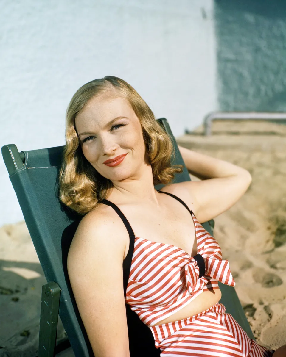 Girl Models Halter Swim Suit - Historic Images