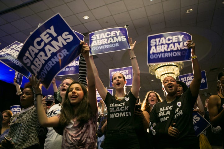 Supporters of Georgia Democratic gubernatorial candidate Stacey Abrams cheer during a rally in Atlanta on May 22. If elected in the fall, she would become the first African-American female governor in the nation.