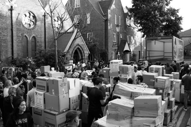 Volunteers sort through boxes of donations which have been collected in the aftermath of the Grenfell Tower fire. 