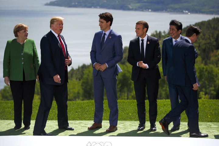 (Left to right) Germany's Angela Merkel, the United States' Donald Trump, Canada's Justin Trudeau, France's Emmanuel Macron, Japan's Shinzo Abe and Italy's Giuseppe Conte get in place for a photo during the G-7 summit in Canada on Friday.