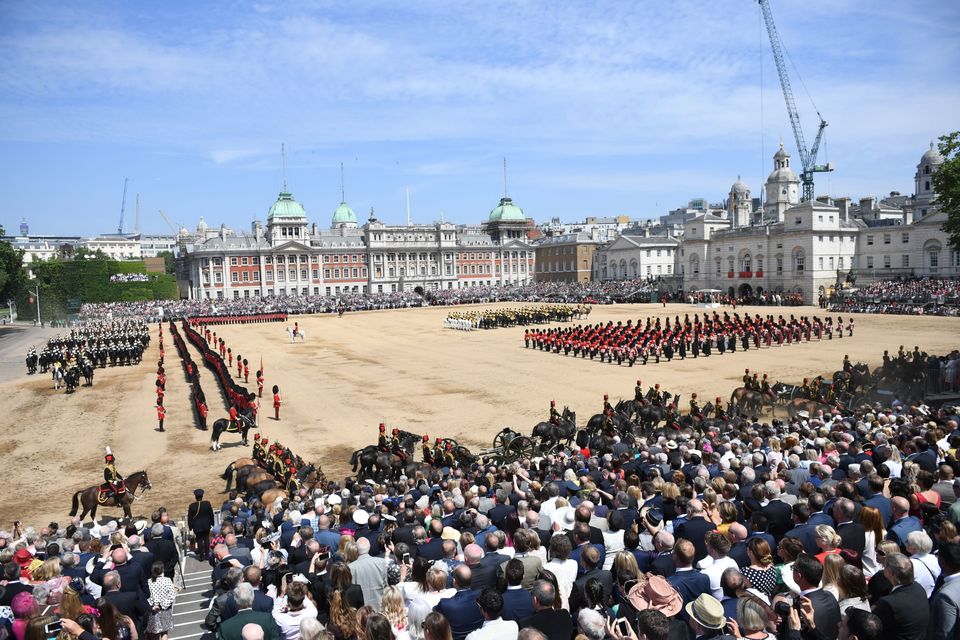 Crowds look on as soldiers of the 1st Battalion Coldstream Guards march during the Trooping the Colour ceremony at Horse Guards Parade.