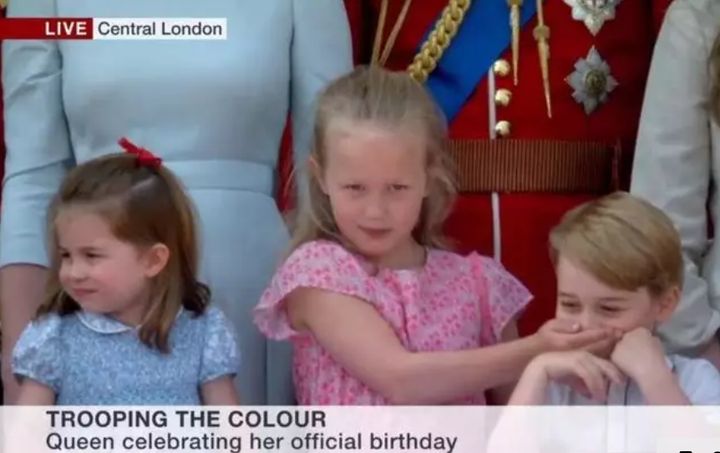 Savannah Phillips puts her hand over Prince George's mouth