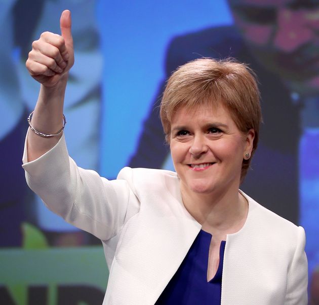 First Minister Nicola Sturgeon arrives on stage during the Scottish National Party's spring conference at the Aberdeen Exhibition and Conference Centre (AECC), Aberdeen.