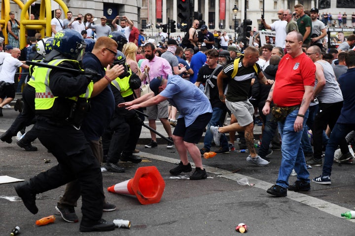 Demonstrators clash with police during rhe 'Free Tommy Robinson' protest on Whitehall