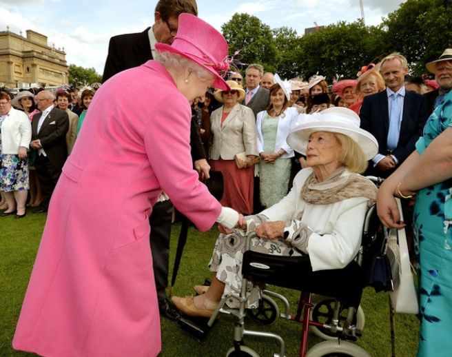 Turgel meeting the Queen at a Buckingham Palace garden party