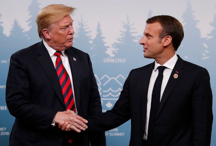 Trump shakes hands with France's President Emmanuel Macron during a bilateral meeting at the G-7 summit on Friday.